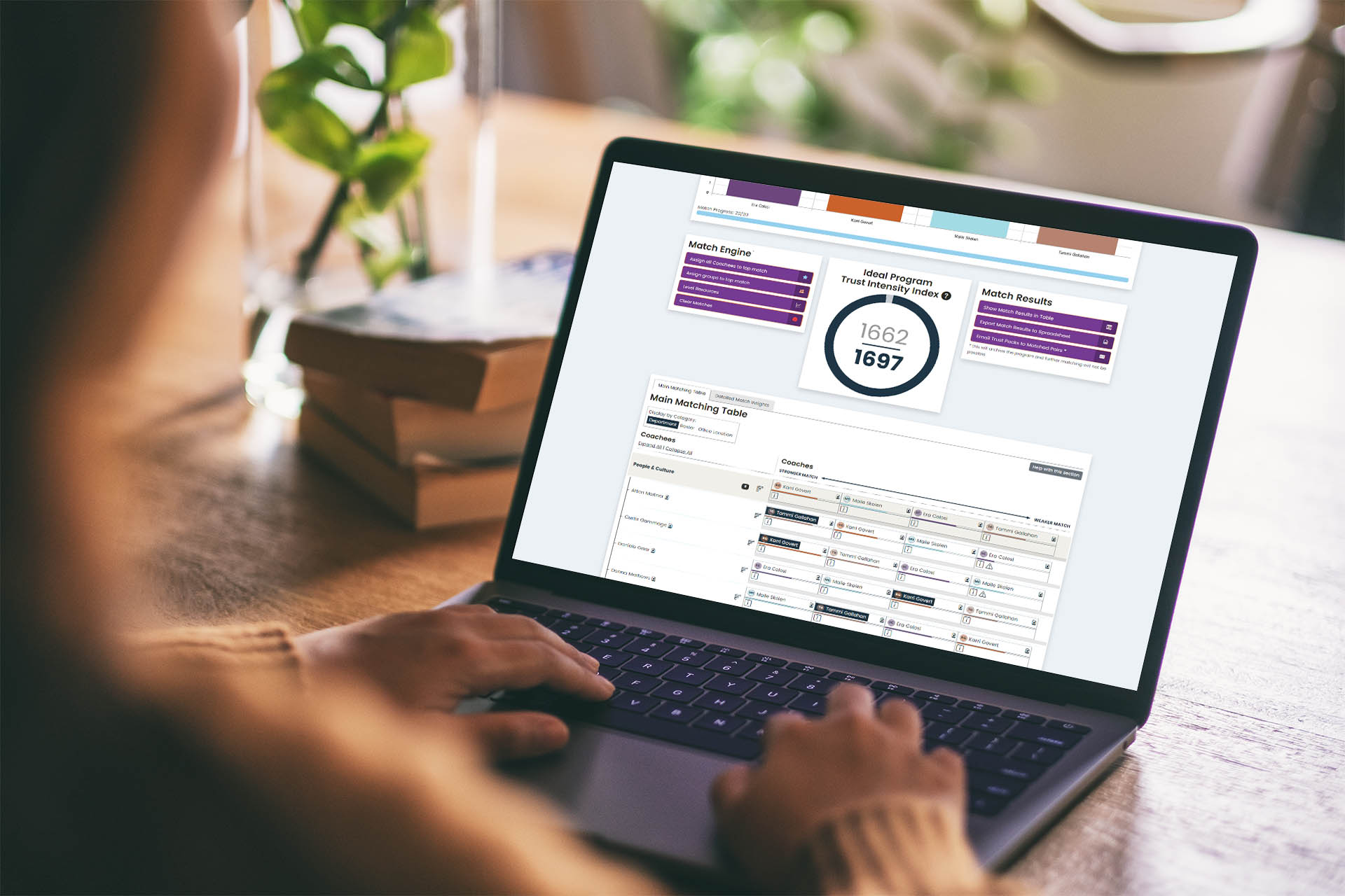 Person using a laptop with the TrustEngine Match Engine on screen.